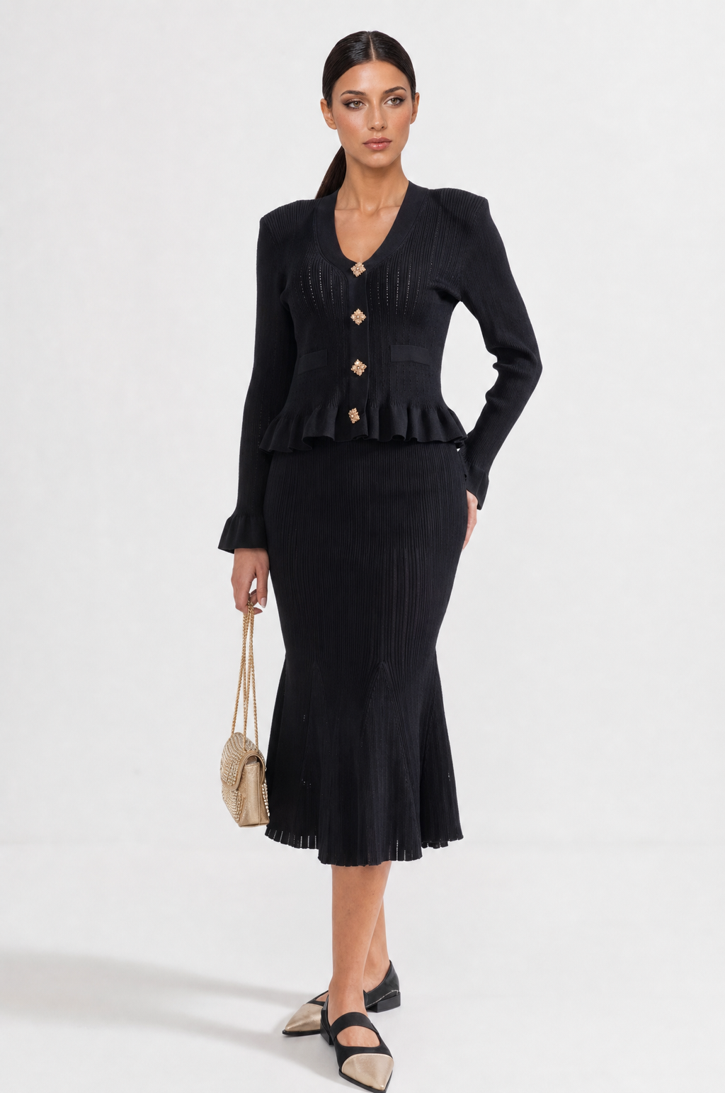 CONJUNTO DE CHAQUETA Y FALDA DE PUNTO CON VOLANTES - NEGRO