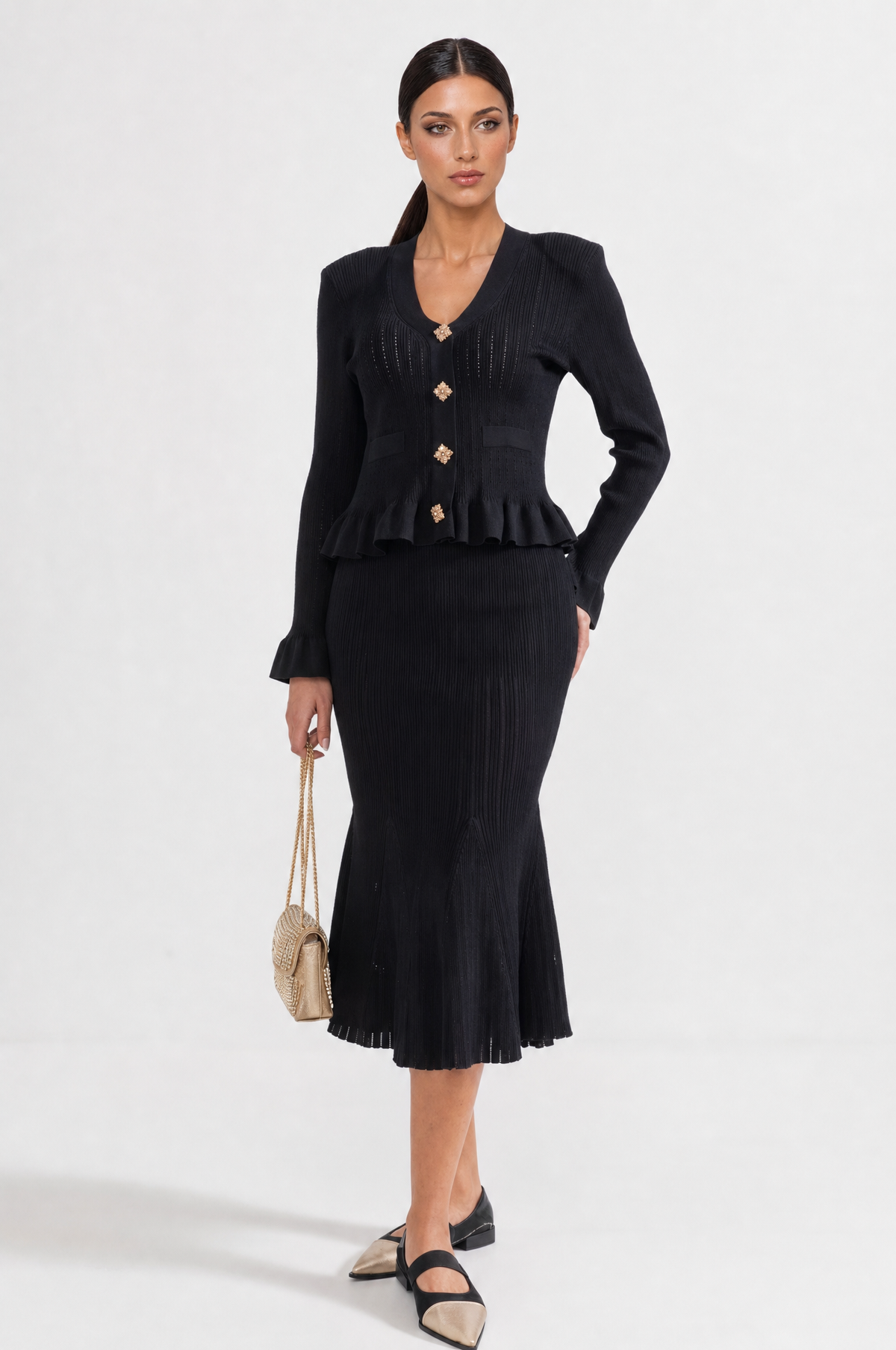 CONJUNTO DE CHAQUETA Y FALDA DE PUNTO CON VOLANTES - NEGRO