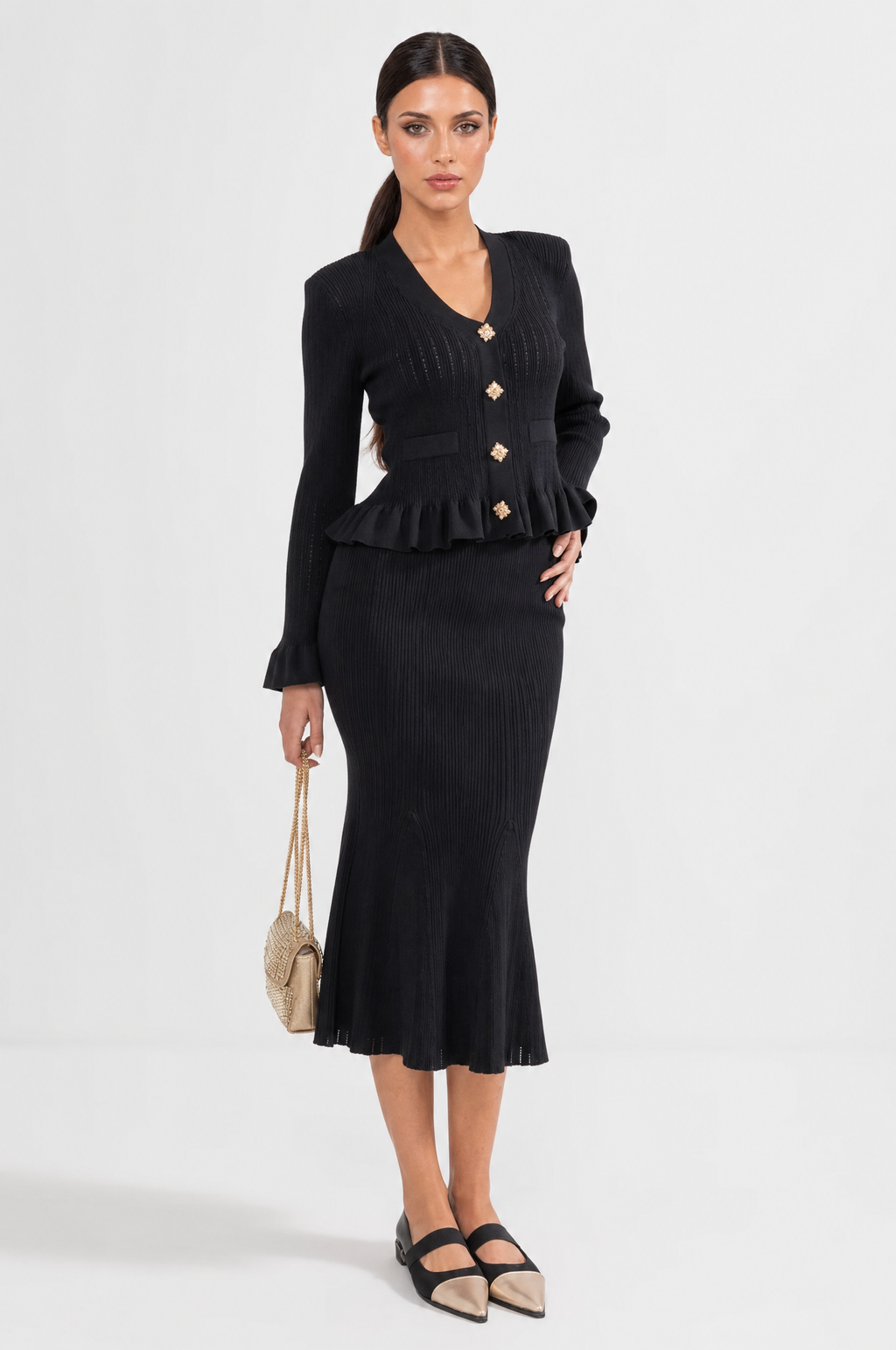 CONJUNTO DE CHAQUETA Y FALDA DE PUNTO CON VOLANTES - NEGRO