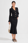 CONJUNTO DE CHAQUETA Y FALDA DE PUNTO CON VOLANTES - NEGRO