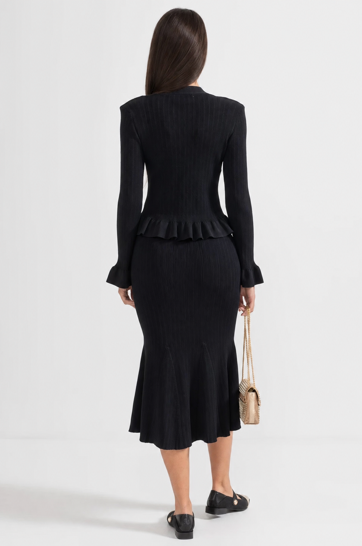 CONJUNTO DE CHAQUETA Y FALDA DE PUNTO CON VOLANTES - NEGRO