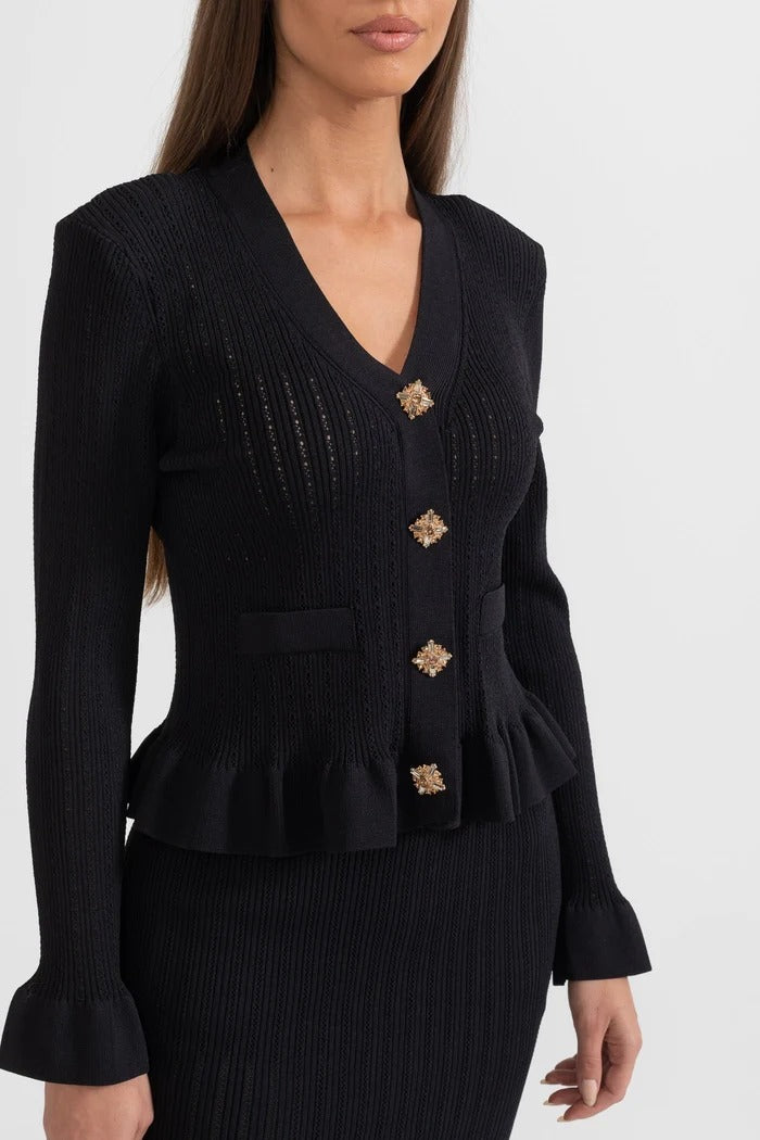 CONJUNTO DE CHAQUETA Y FALDA DE PUNTO CON VOLANTES - NEGRO