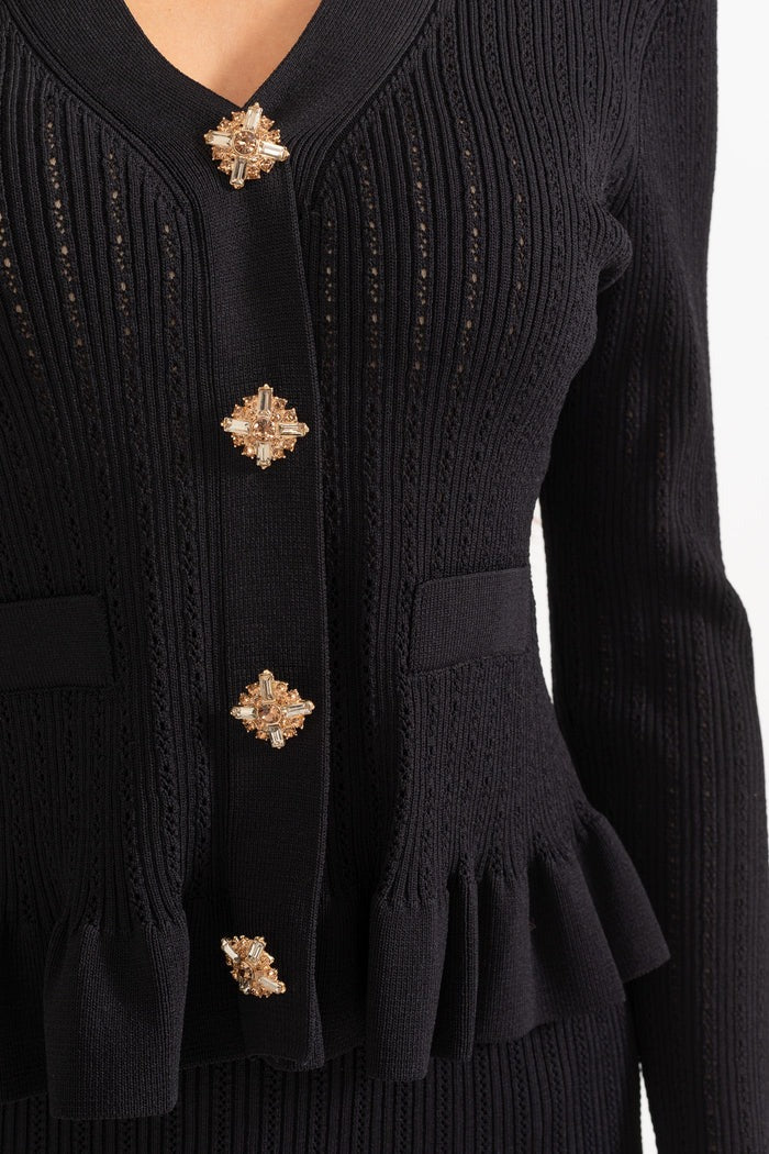 CONJUNTO DE CHAQUETA Y FALDA DE PUNTO CON VOLANTES - NEGRO