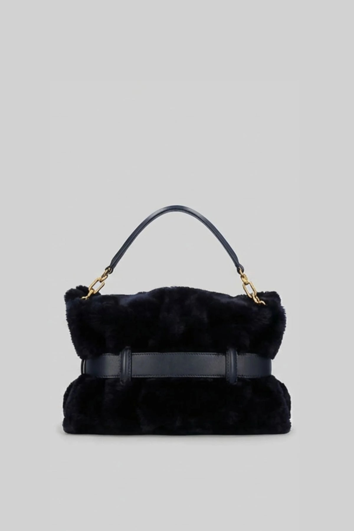 BOLSO DE MANO CON PELO SINTÉTICO Y HEBILLA DECORATIVA - NEGRO