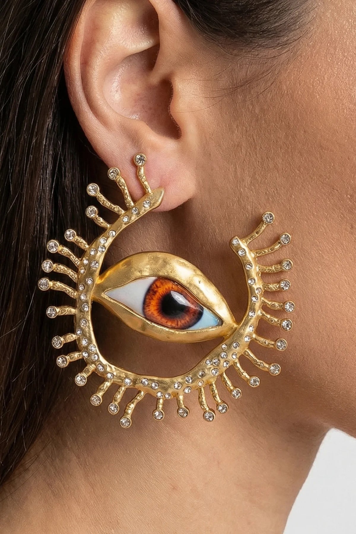 PENDIENTES DE BOTÓN CON OJO Y RAYOS DE CRISTAL - ORO